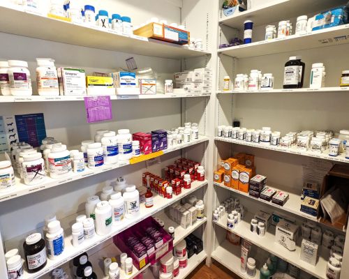 A pharmacy aisle filled with various medicines